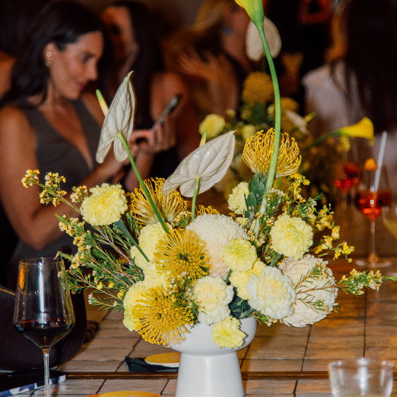 yellow and white flowers on bar 