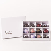 Box of chocolates with 'little cocoa' branding on a white background