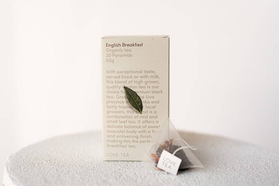 Box of English Breakfast tea with a single teabag on a white background
