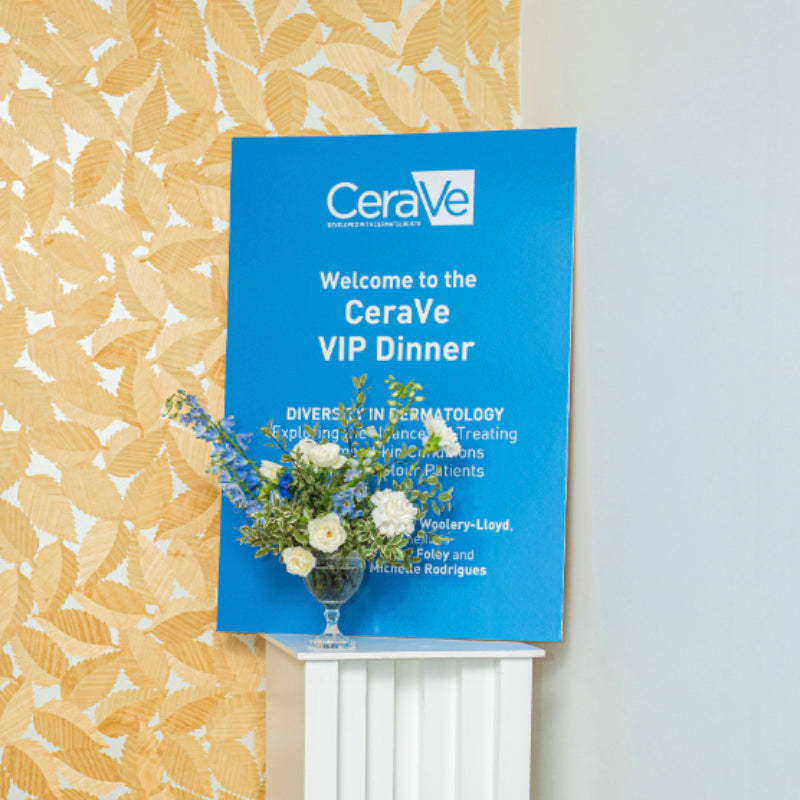 CeraVe VIP Dinner sign with flowers on a decorative wall