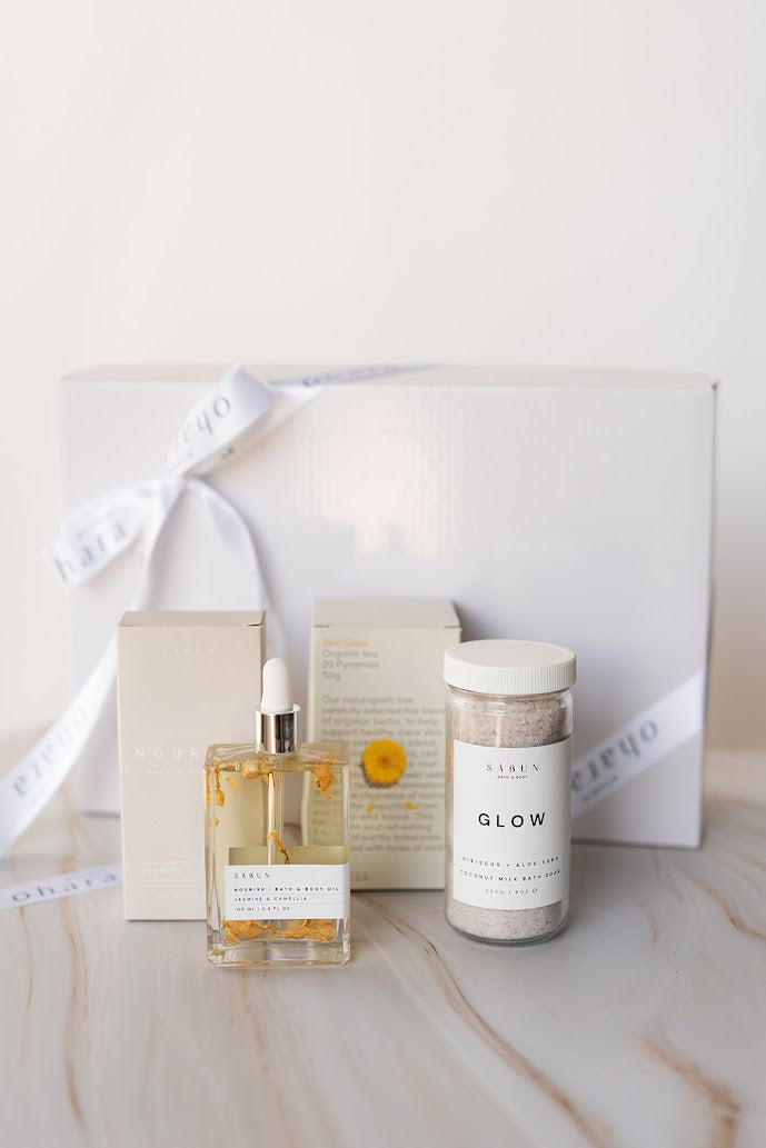 Skincare products on a marble surface with a white background