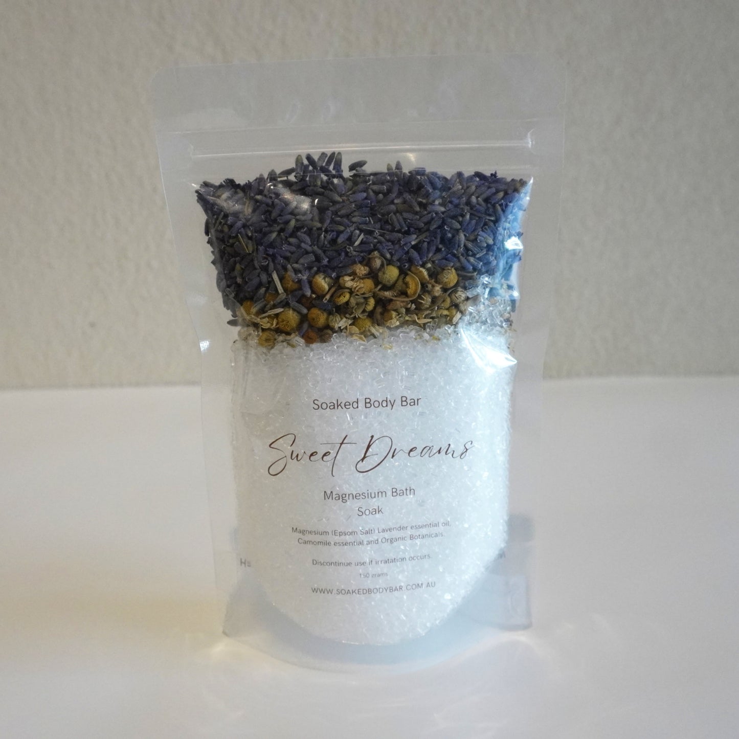 Bag of 'Sweet Dreams' magnesium bath salt with lavender and chamomile on a white background