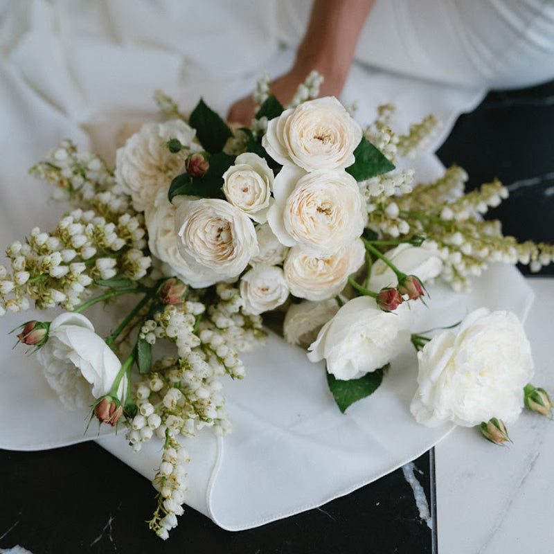 Bouquet of white roses on a marble surface